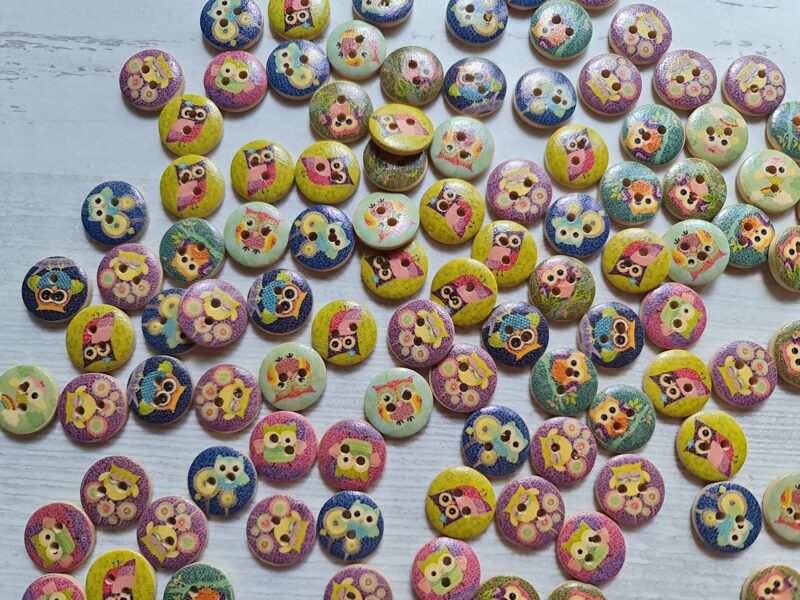 Wooden button, colourful, with animal pictures on them 